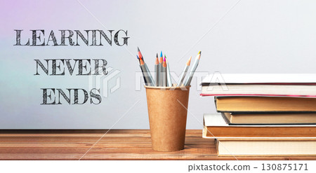 Stack of books with the words learning never ends Stack of books with the words learning never ends 130875171