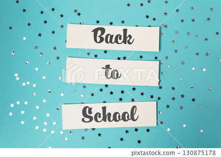 Blue background with a white sign that reads Back to School. Blue background with a white sign that reads Back to School. 130875178