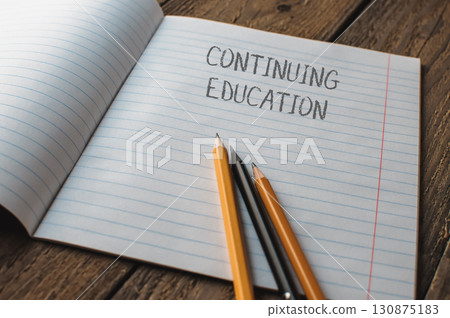 Notebook with the words Continuing Education written on it 130875183