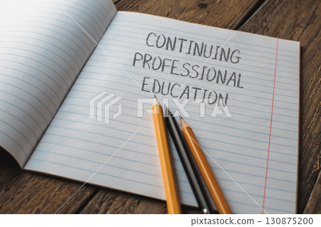 A notebook with pencils on it A notebook with pencils on it 130875200