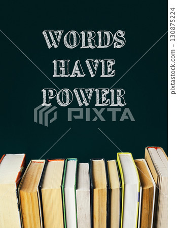A stack of books with the words Words have power written above them 130875224