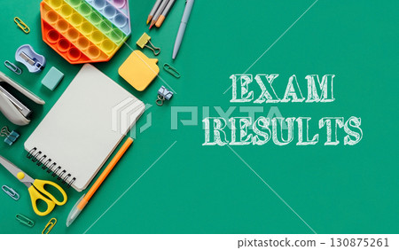 Exam results are written on a green background with a notebook, pens Exam results are written on a green background with a notebook, pens 130875261