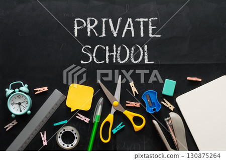Private school supplies on a blackboard Private school supplies on a blackboard 130875264