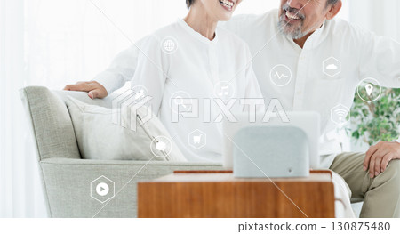 A senior couple using DX services 130875480