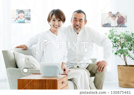 A senior couple using DX services 130875481