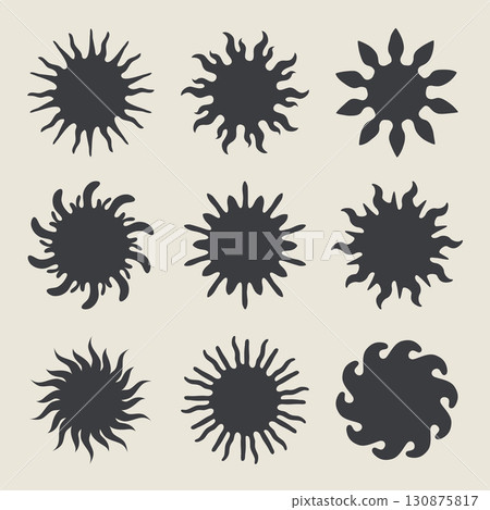 Abstract black sun shapes with various ray designs on light background 130875817