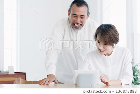 A senior couple using DX services 130875888