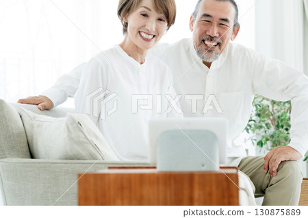 A senior couple using DX services 130875889