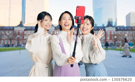 A group of female tourists taking selfies at tourist spots. Girls' trip A group of female tourists taking selfies at tourist spots. Girls' trip 130876620