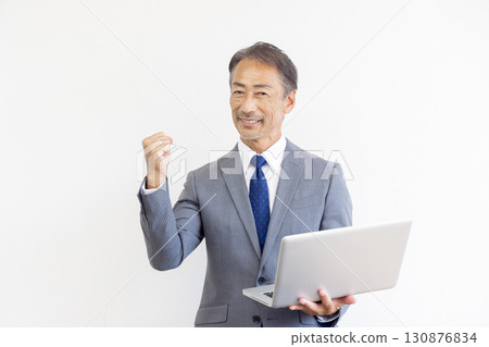 Senior men using laptops 130876834