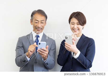Businessman boss subordinate using smartphone Businessman boss subordinate using smartphone 130876913