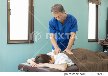 Osteopathic doctor and patient 130876933