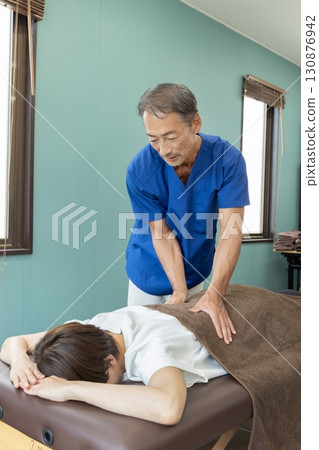 Osteopathic doctor and patient Osteopathic doctor and patient 130876942