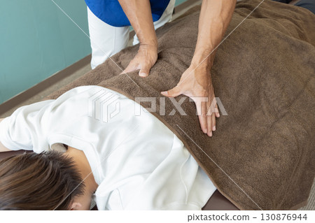Osteopathic doctor and patient Osteopathic doctor and patient 130876944