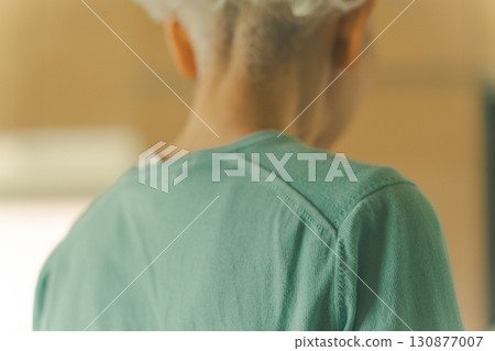 Elderly woman's back 130877007