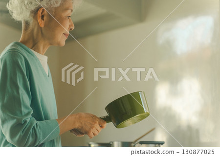 Seniors cooking for themselves Seniors cooking for themselves 130877025