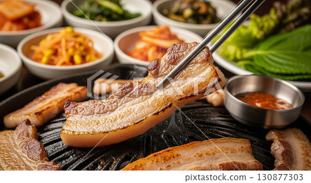 Grilled Korean Pork Belly Samgyeopsal Served with Chopsticks Grilled Korean Pork Belly Samgyeopsal Served with Chopsticks 130877303