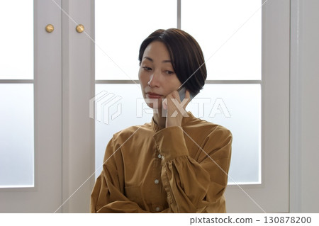 Woman doing phone call Woman doing phone call 130878200