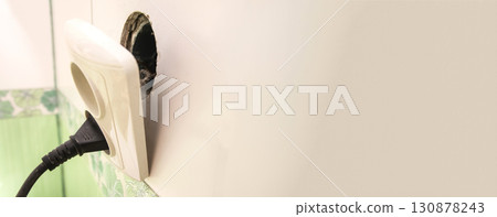 banner with a broken electric socket. broken electric socket danger banner. electrical outlet repair safety. house fire risk warning. home electric services copy space 130878243