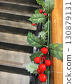 Holly decorations on the staircase railing 130879131