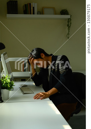 Tired office worker experiencing frustration and mental fatigue during busy workday Tired office worker experiencing frustration and mental fatigue during busy workday 130879175