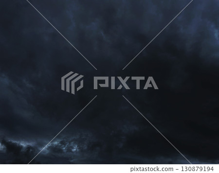 Background image 3 of a dark black-gray cloudy sky covered with rain clouds 130879194