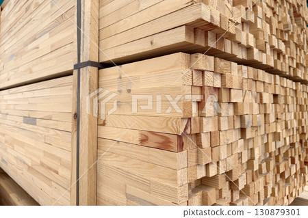 Wooden boards and slabs in the warehouse of the hardware store or in a construction hypermarket. Wooden boards and slabs in the warehouse of the hardware store or in a construction hypermarket. 130879301