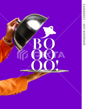 Graphic composition. Boo ghost text on silver tray with orange sleeve hand and bright purple background 130880051