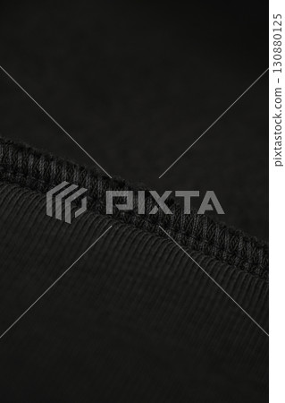Dark green khaki textile with seam. Inner loop seam of clothing. Black. Dark green khaki textile with seam. Inner loop seam of clothing. Black. 130880125