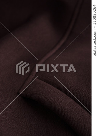 Dark brown fabric with neat stitching. Sweatshirt pocket. Cotton. Dark brown fabric with neat stitching. Sweatshirt pocket. Cotton. 130880264