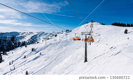 Ski Lift Ascending Snowy Mountain in Austria Winter Sports Adventure in the Austrian Alps Ski Lift Ascending Snowy Mountain in Austria Winter Sports Adventure in the Austrian Alps 130880722
