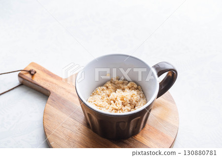 Rice-like oatmeal in a mug 130880781