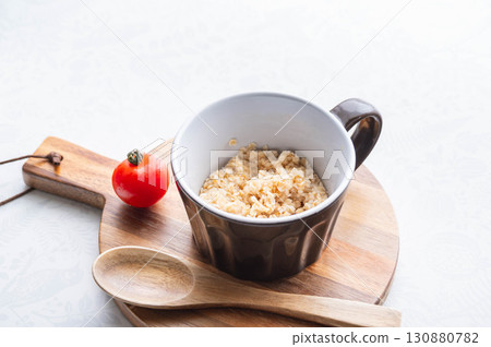 Rice-like oatmeal in a mug 130880782