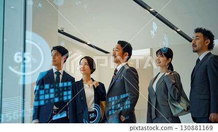 Group of business people standing in office and statistical data 130881169
