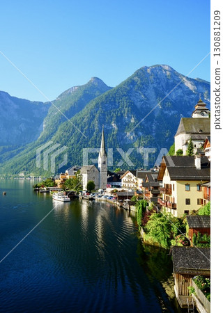 A stunning view of the beautiful village of Hallstatt, a World Heritage Site in Austria, reflected on Lake 130881209
