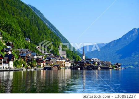 A stunning view of the beautiful village of Hallstatt, a World Heritage Site in Austria, reflected on Lake A stunning view of the beautiful village of Hallstatt, a World Heritage Site in Austria, reflected on Lake 130881227