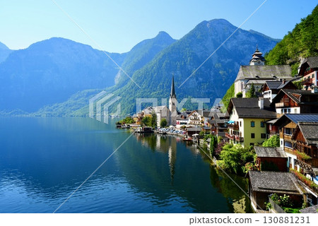 A stunning view of the beautiful village of Hallstatt, a World Heritage Site in Austria, reflected on Lake 130881231