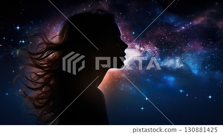 dreamy night portrait of beautiful young woman on sky with stars and galaxy background, female with waving hairs 130881425