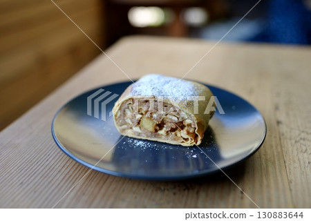 Enjoy the traditional Austrian dessert, apple strudel, at your hotel table Enjoy the traditional Austrian dessert, apple strudel, at your hotel table 130883644
