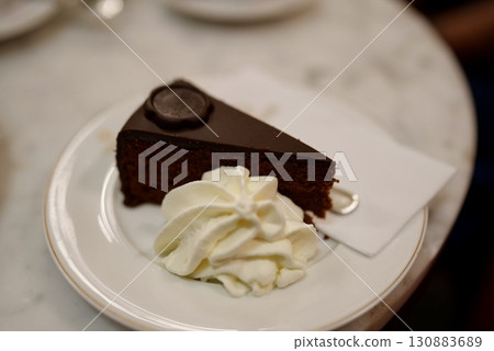 A beautiful chocolate cake dessert, Sachertorte, a specialty of Vienna's Cafe Sacher A beautiful chocolate cake dessert, Sachertorte, a specialty of Vienna's Cafe Sacher 130883689