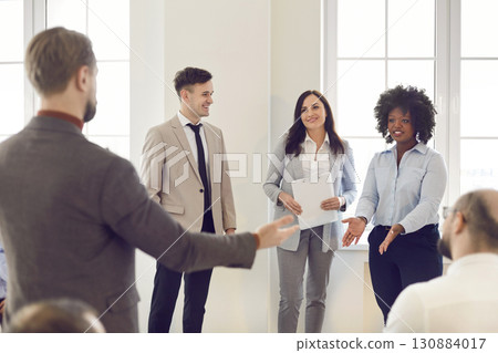 Colleagues Listening To Boss During Office Meeting Colleagues Listening To Boss During Office Meeting 130884017