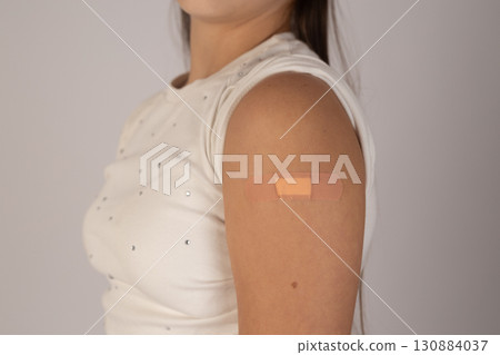 Woman with small patch on arm. Woman with small patch on arm. 130884037