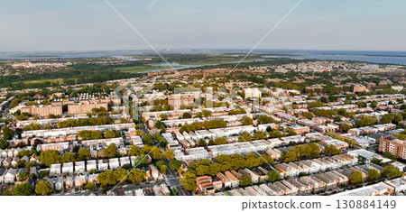 a residential area with numerous two-bedroom garden-style apartment buildings a residential area with numerous two-bedroom garden-style apartment buildings 130884149