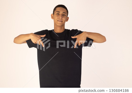Man in black shirt pointing finger at camera 130884186