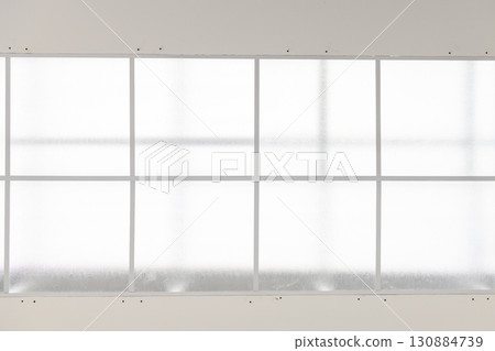Bright architectural detail of window during house renovation project. calm construction scene highlights simple geometric frame for modern interior design 130884739