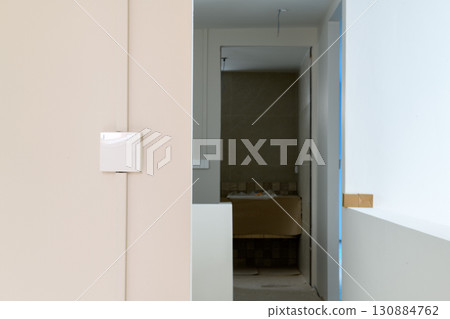 Calm interior detail of modern house renovation showing minimalist hallway and architectural construction. serene view of new building project design progress 130884762