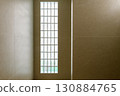 Calm architectural detail of glass block window during house renovation. simple construction and minimalist design create serene interior with soft natural light 130884765