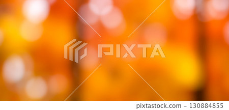 warm autumn bokeh background with golden and orange blurred lights, a beautiful abstract texture for festive holiday or seasonal concept 130884855