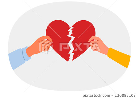 Broken heart symbolizing separation and destruction of relationships in hands of people 130885102