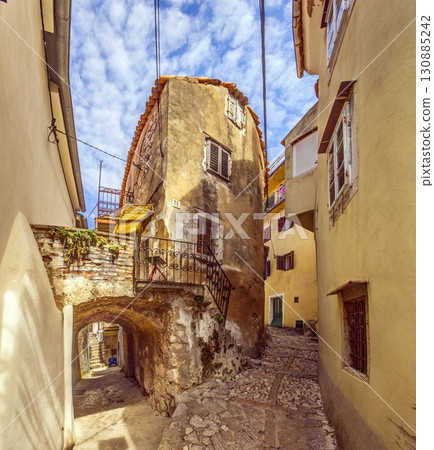 Narrow cobbled alley in old Vrbnik Croatia Narrow cobbled alley in old Vrbnik Croatia 130885242